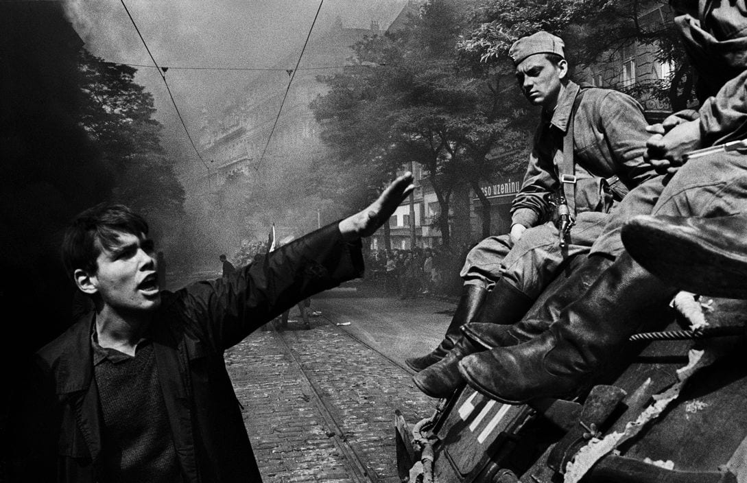 Josef Koudelka, "CZECHOSLOVAKIA. Prague. August 1968. Invasion by Warsaw Pact troops in front of the Radio headquarters."