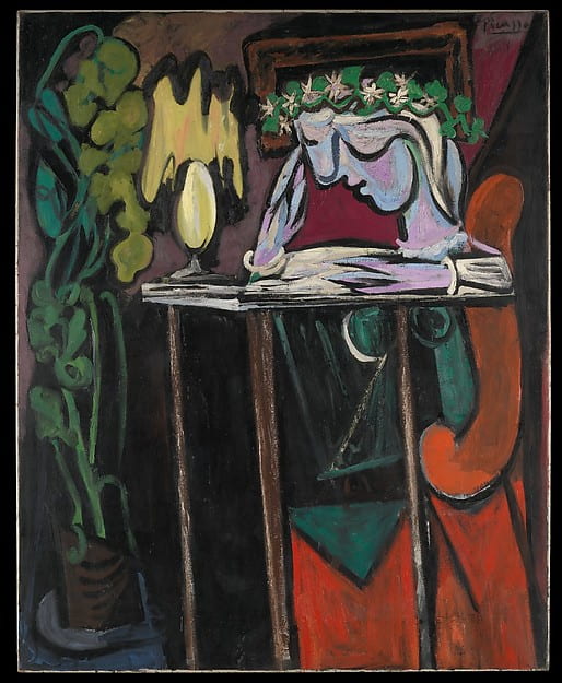 Picasso, reading at a table